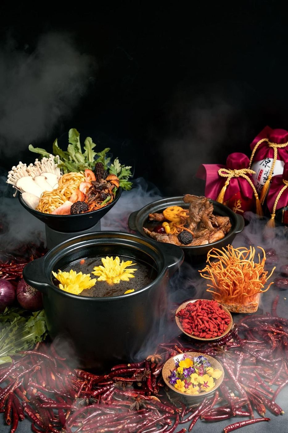 A spread of Indian dishes on a dark table