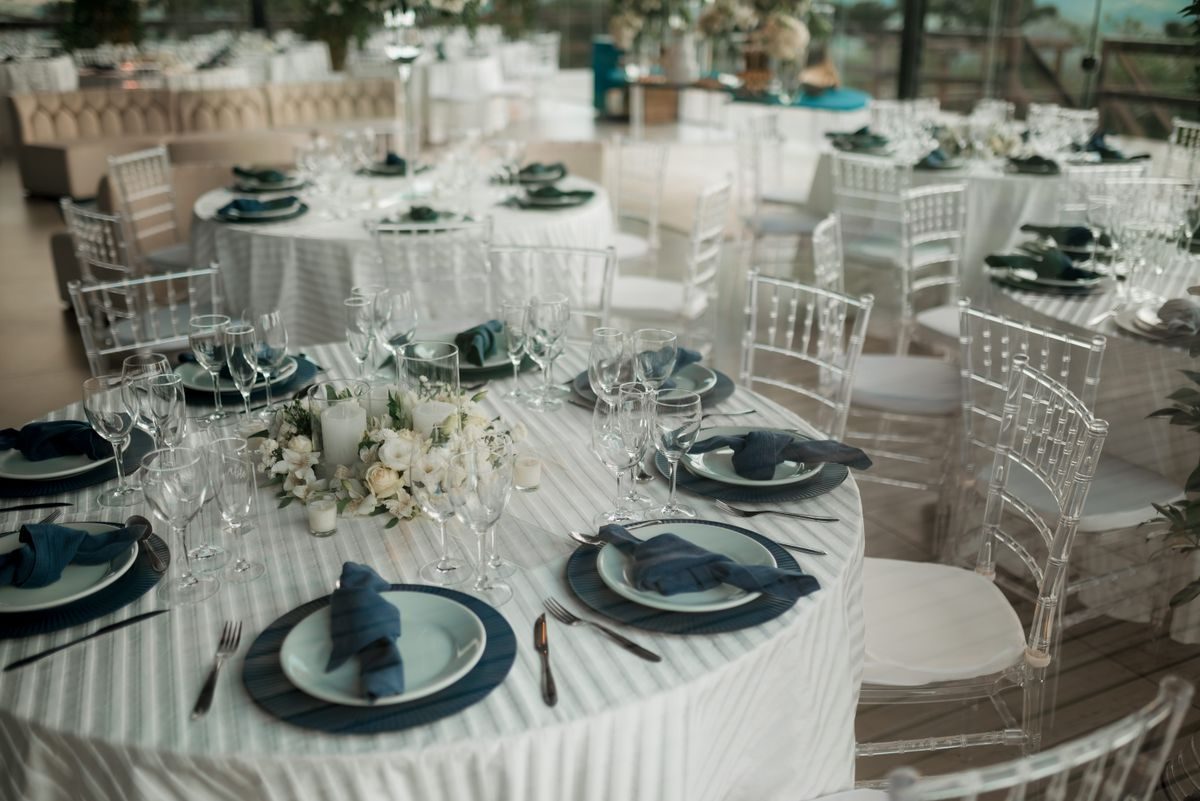 Round banquet tables set with white linen